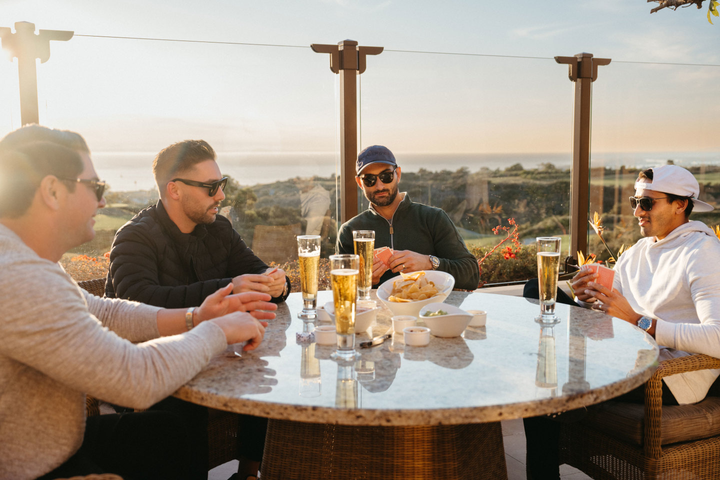 golf buddies enjoy villa terrace