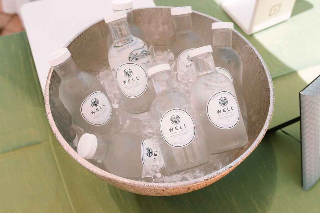 alkaline well water bottles in bucket