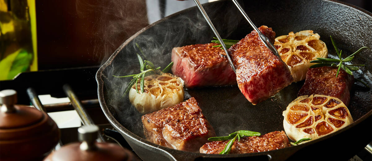 meat grilling in pan